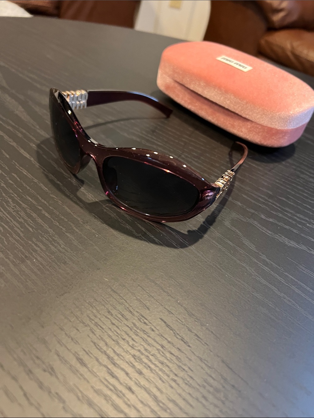 Miu Miu Deep Plum Oval Sunglasses with Silver Temple Accents